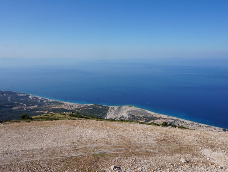A view of the ocean from the top of a hill