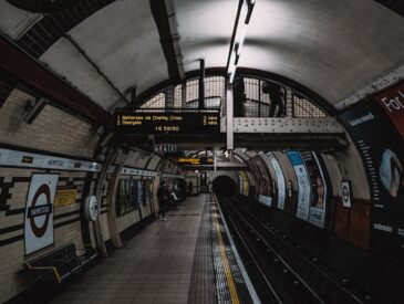 a subway station with a train on the tracks