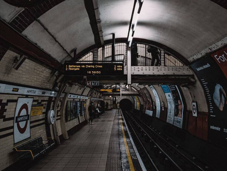 a subway station with a train on the tracks