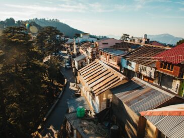 a view of a town with a mountain in the background