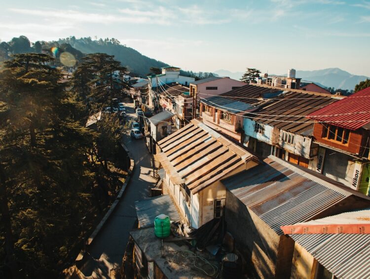 a view of a town with a mountain in the background