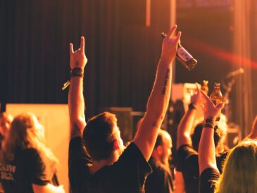 a group of people raising their hands in the air