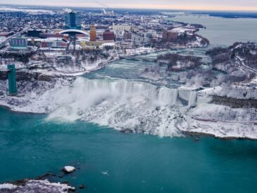 Niagara falls is partially frozen during winter.