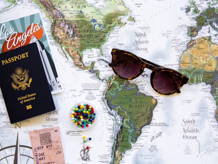brown framed sunglasses on map