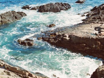 a view of a body of water near some rocks