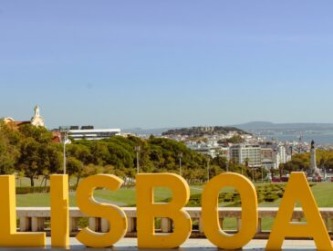 Large yellow lisboa letters with city view