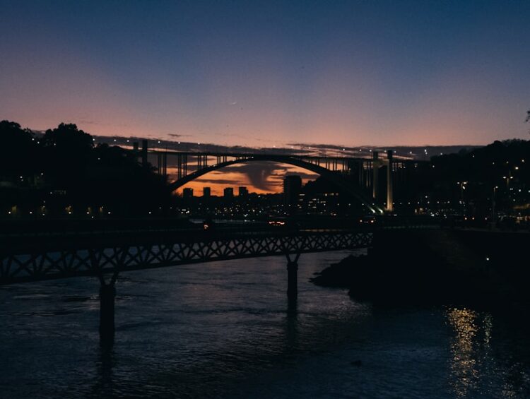 a bridge over a body of water at night