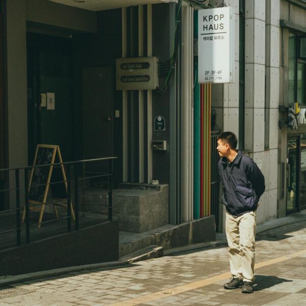 A man walks in front of a K-pop themed building in downtown Seoul, South Korea.